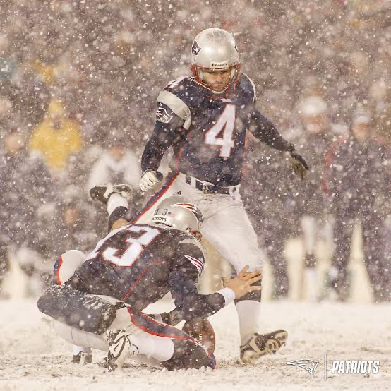 New England Patriots playing in the snow